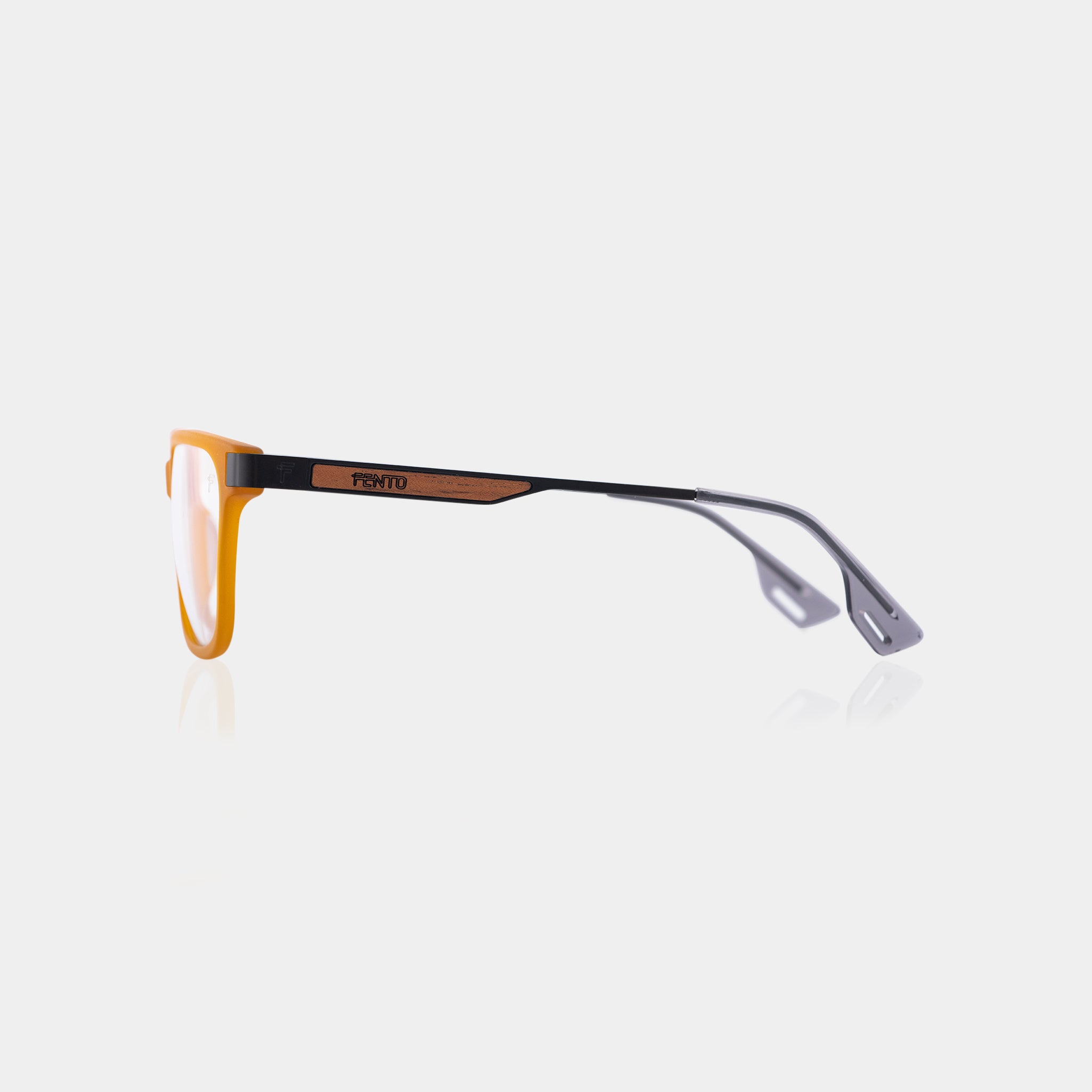 Lentes Specta Iron – acabado bicolor miel y negro en acetato. Diseñadas en Medellín. Envíos en Colombia.